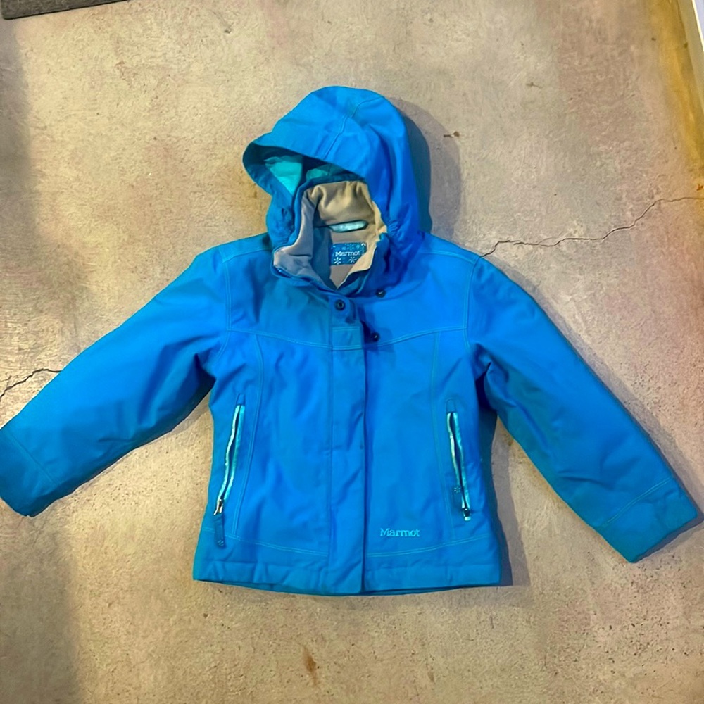 Kids Marmot blue ski coat.